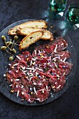 Bresaola ai capperi (beef with capers and bread, Italy)