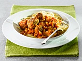 Spaghetti with a bean and meatball sauce