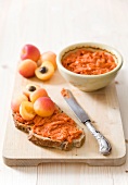 Bread topped with Sobrassada (Spanish pepper sausage spread) and apricots
