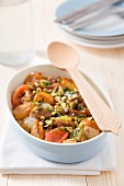 Lamb tajine with apricots, tomatoes, onions and pistachios