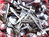 A pile of freshly washed cutlery