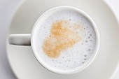 A cup of coffee with milk foam
