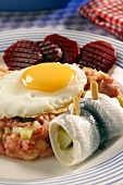 Lobscouse with soused herring and a fried egg (Germany)