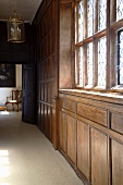 Lobby with wood paneling and leaded window