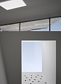 Brand new home with deep window niches and wedge-shaped skylight