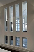 Lobby with narrow windows and view of a grand room