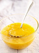 Mango coulis in a glass bowl