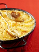 Potatoes au gratin with goose liver