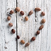 Nutmeg Heart on Rustic White Washed Wood