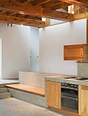 Custom made kitchen counter and stone bench with wooden seat