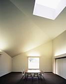 Minimalist dining room and retro chairs around a table