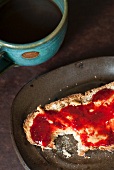 Peanut Butter and Jelly on Spelt Toast; Bitten; With Coffee