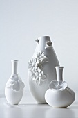 White vases decorated with flowers