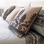 Decorative cushions on a double bed