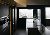 Modern open-plan kitchen with a view