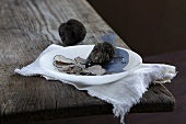 Black summer truffles, whole and sliced