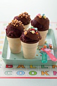 Berry ice cream with chocolate glaze in ice cream cones