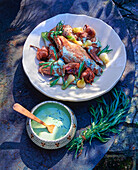 Rabbit with garlic, spring onions and tarragon sauce