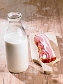 A bottle of milk and bacon