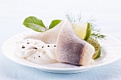 Soused herring fillets with limes and sour cream