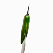 A chilli pepper being sliced open