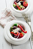 Greek salad made with feta cheese, cucumbers, peppers, tomatoes and olives