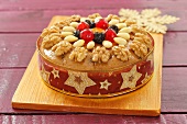 A fruit cake with almonds and walnuts