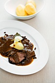 Horse Sauerbraten (meat braised in vinegar) with salted potatoes