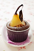 A poached pear in a chocolate cake