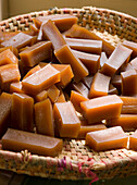 Homemade caramel sweets in a woven basket