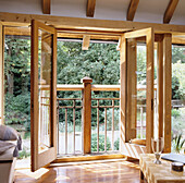 Open doors to balcony with garden view