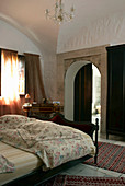 Double bed in bedroom with vaulted ceiling