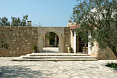 Stone house with olive tree in courtyard (Tunisia)