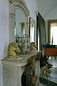 Pair of horse-head ornaments on stone fireplace