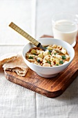 Noodle soup with beans, potato and parsley