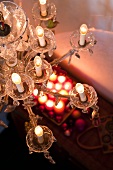 An antique chandelier in a living room decorated for Christmas