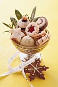 Various Christmas biscuits in a silver bowl