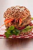 A burger with grated carrots