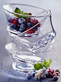 Frozen berries in stacked glass dishes