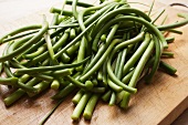 Garlic Scapes; The Green Part of the Garlic Plant; On Cutting Board