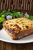 Croque Monsieur with Cheese on the Top on a White Plate