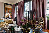 Living room with floor-length curtains and armchair with zebra pattern