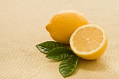 Whole and Half a Lemon with Fresh Tea Leaves