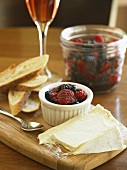 Cheese Wedge with Berry Compote and Bread Slices
