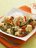 Chicken Vegetable Stew on a Square Plate with Rice