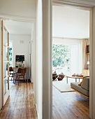 View of dining area and living room through open doors