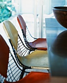 Wire mesh chairs with leather covers