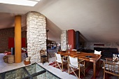 Dining area in open-plan attic room of Mediterranean country house