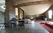 Open-plan interior with stone walls in Mediterranean country house