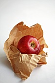 A red apple on a piece of paper